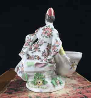 Meissen figure of a seated Turk lady, by J.F.Eberlein, c. 1750, later decorated. -16567
