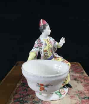 Meissen figure of a seated Turk lady, by J.F.Eberlein, c. 1750, later decorated. -16568