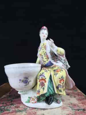 Meissen figure of a seated Turk lady, by J.F.Eberlein, c. 1750, later decorated. -16569