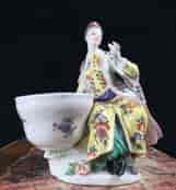 Meissen figure of a seated Turk lady, by J.F.Eberlein, c. 1750, later decorated. -16574