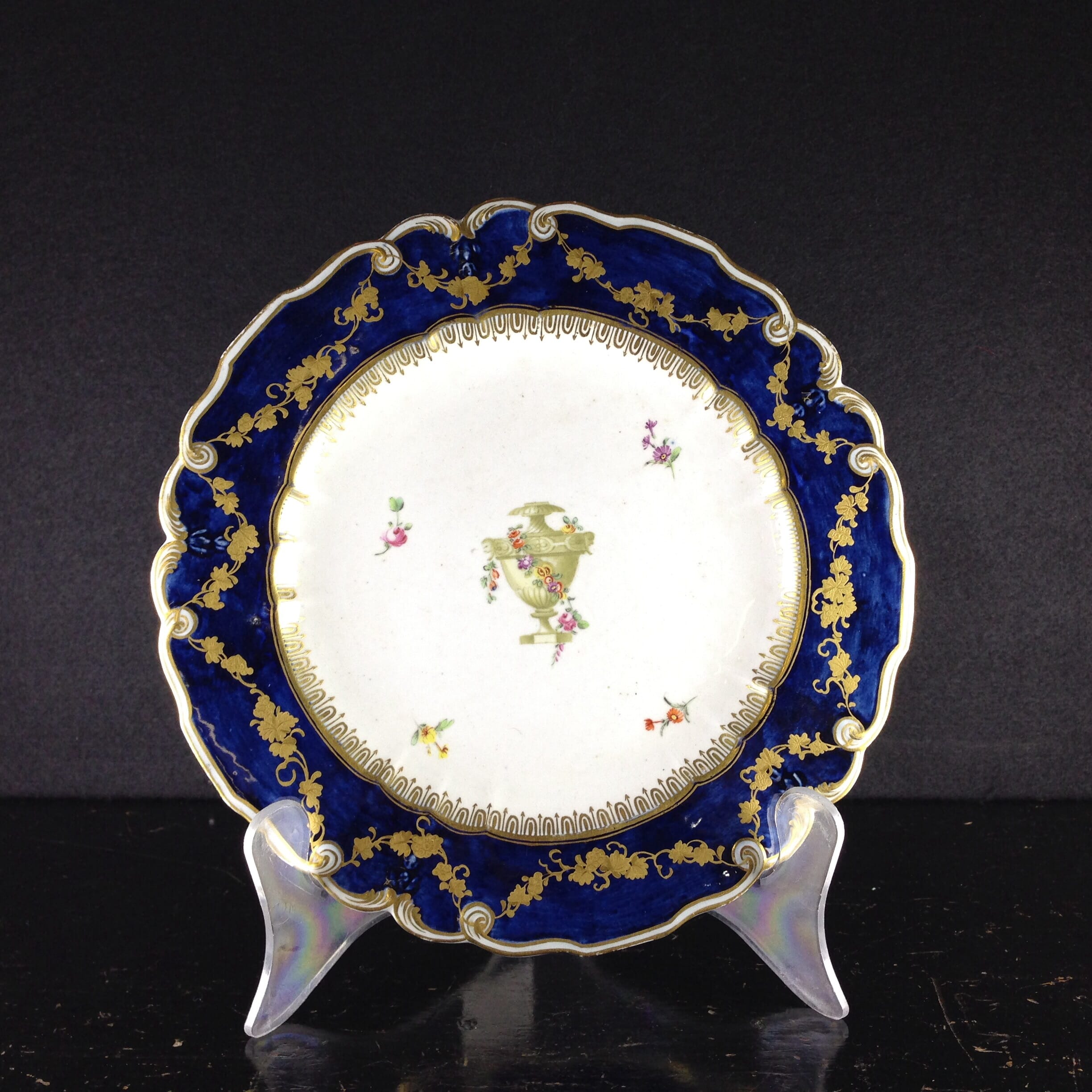 Chelsea plate with blue gilt moulded border, urn to centre, c.1760 -0