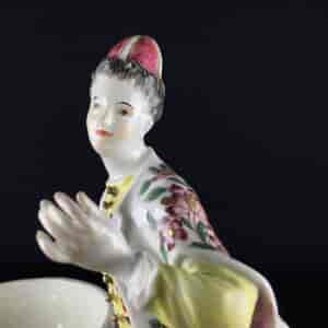 Meissen figure of a seated Turk lady, by J.F.Eberlein, c. 1750, later decorated. -9711