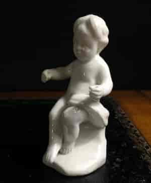 Orleans white porcelain figure of a seated boy, c. 1760 -10289