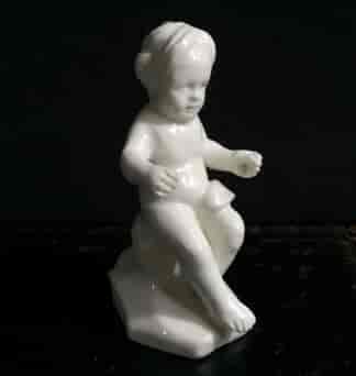 Orleans white porcelain figure of a seated boy, c. 1760 -0