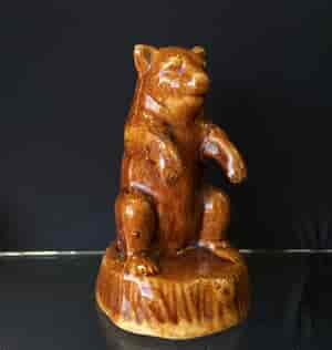 Bear shaped brown glazed pottery money box, 19th C. -23859