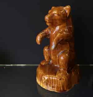 Bear shaped brown glazed pottery money box, 19th C. -23861