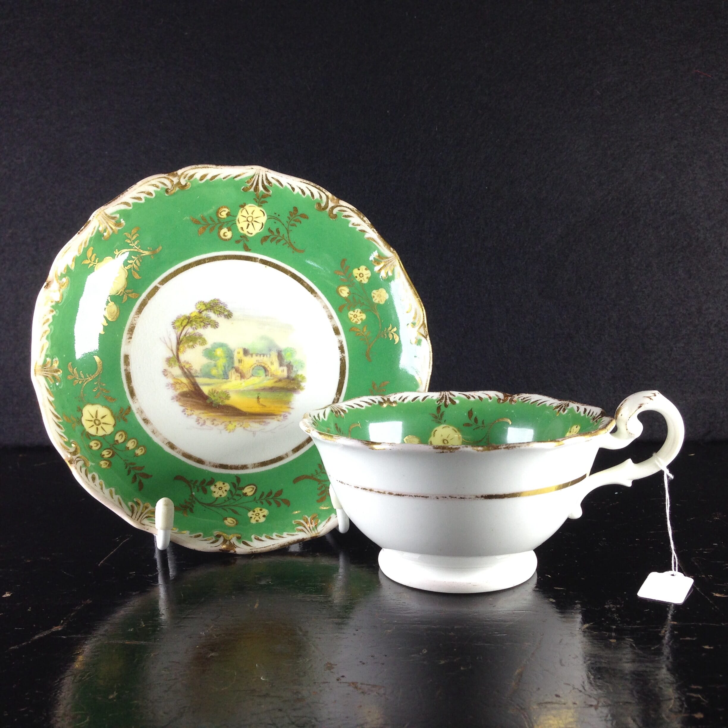 Coalport green ground teacup & saucer with scenes, pattern 509, c.1835-0