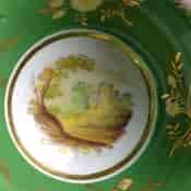 Coalport green ground teacup & saucer with scenes, pat.509, c.1835-1704