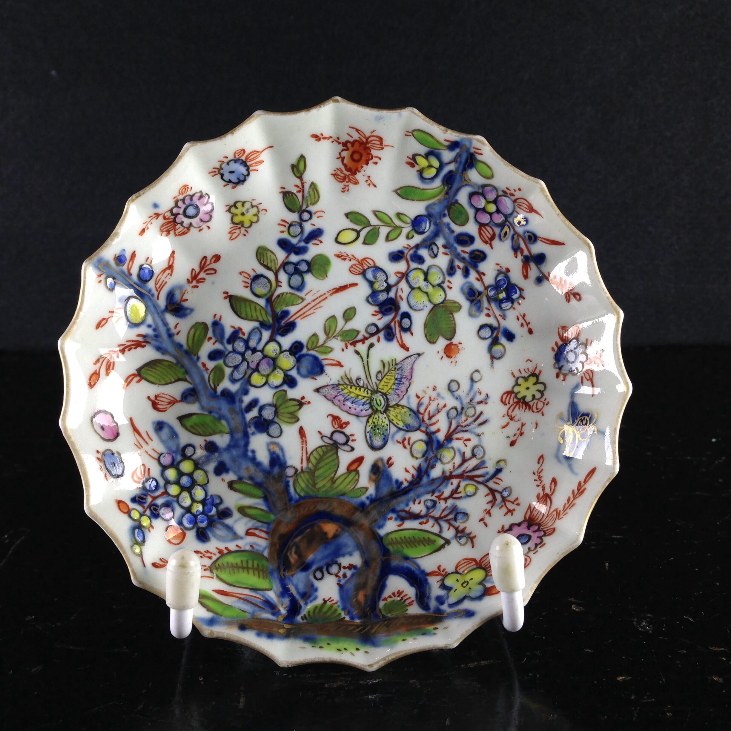Worcester fluted saucer, prunus root, with bright clobbering, 1752 & later -0