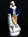 Staffordshire miniature pottery figure of a youth, circa 1850. -0