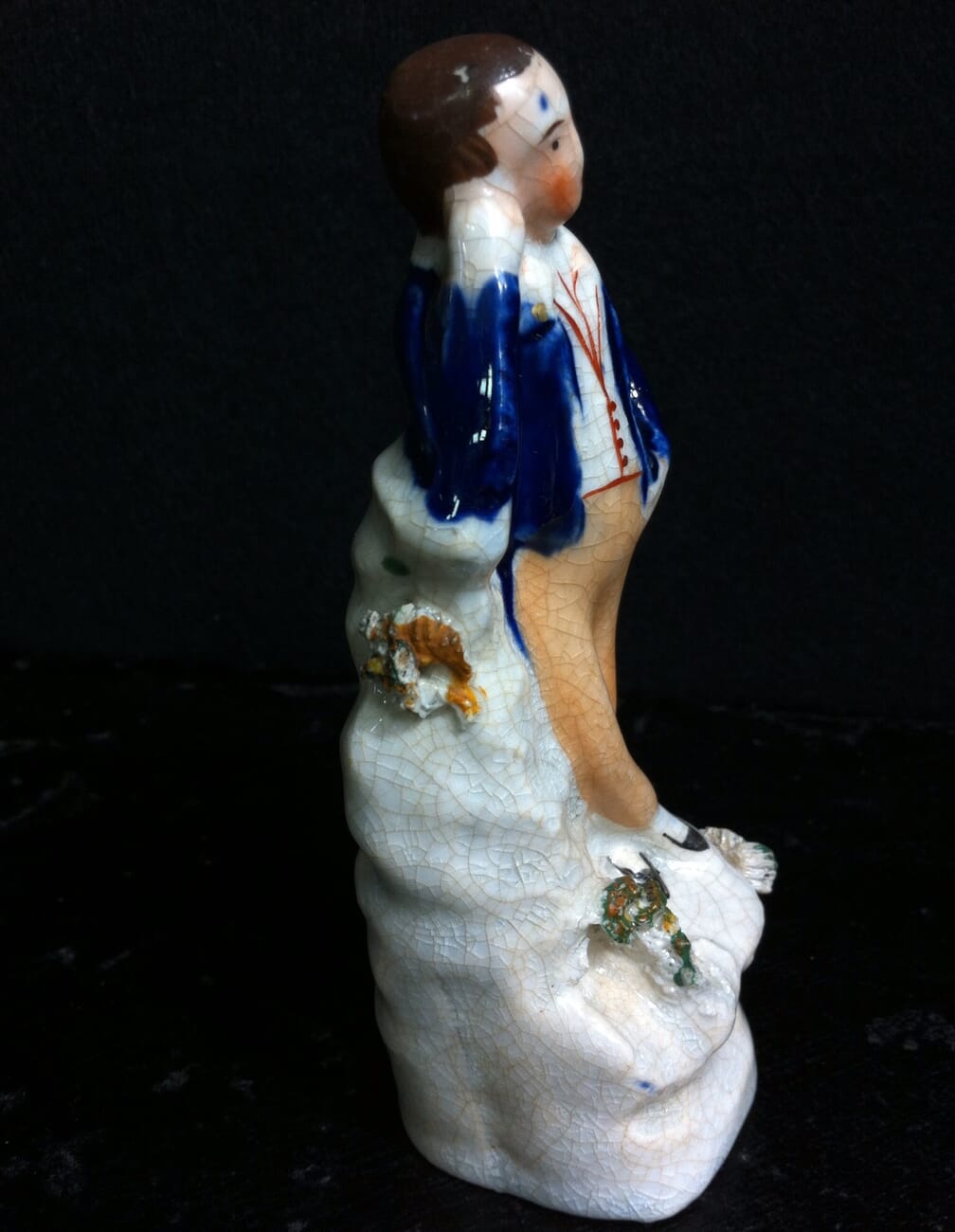 Staffordshire miniature pottery figure of a youth, circa 1850. -10967