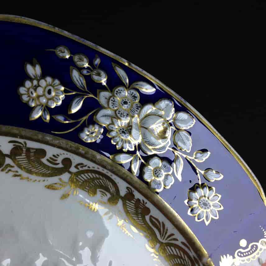 Coalport plate, moulded blue border with fine flowers, c.1820. -1372