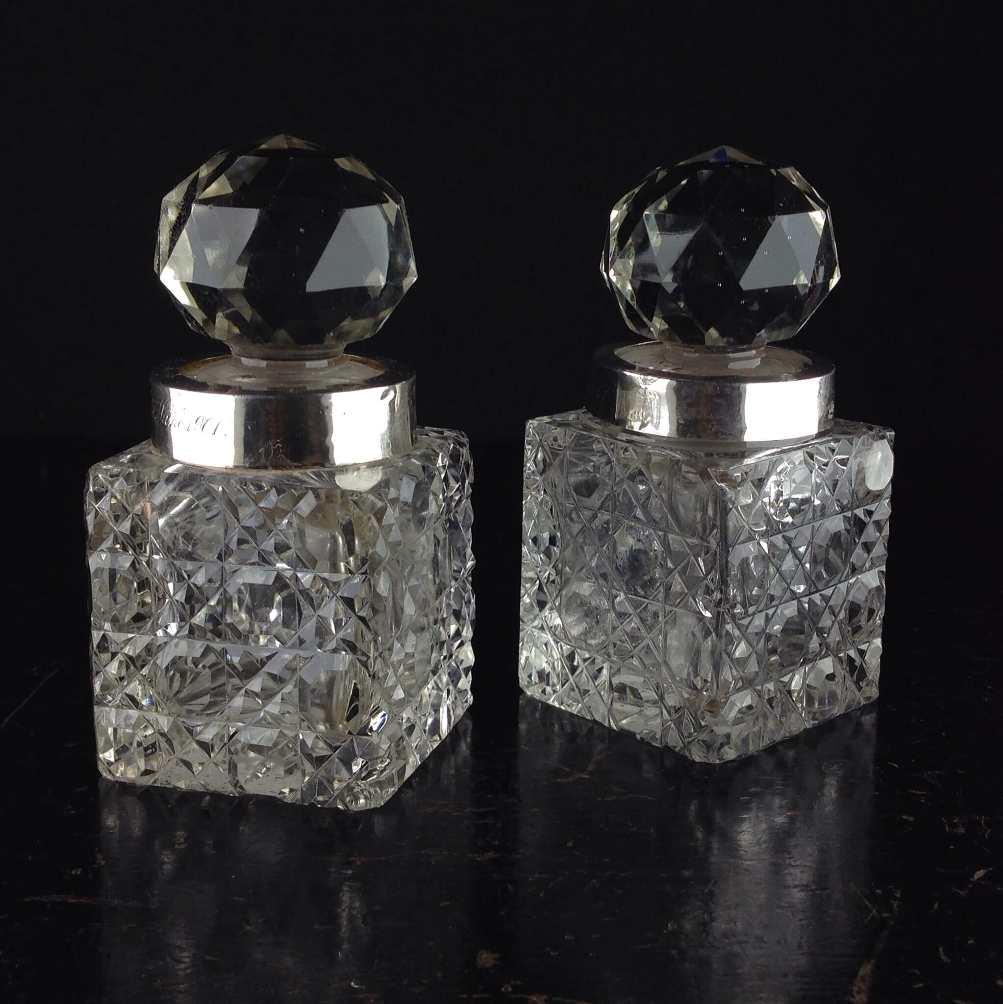 Pair of hobnail cut crystal perfume dressing table bottles, silver mounts London 1899-0