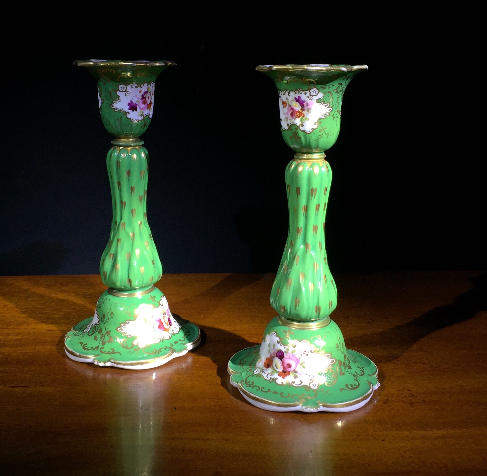 Pair of porcelain candlesticks, green with flowers, c.1830-0