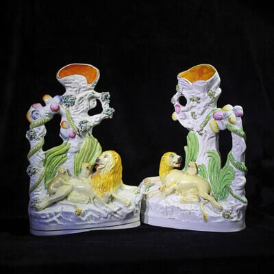 Pair of Staffordshire pottery 'Lions Pride' spill groups, c. 1865-0