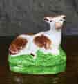 Staffordshire pottery seated cow, c. 1825-0