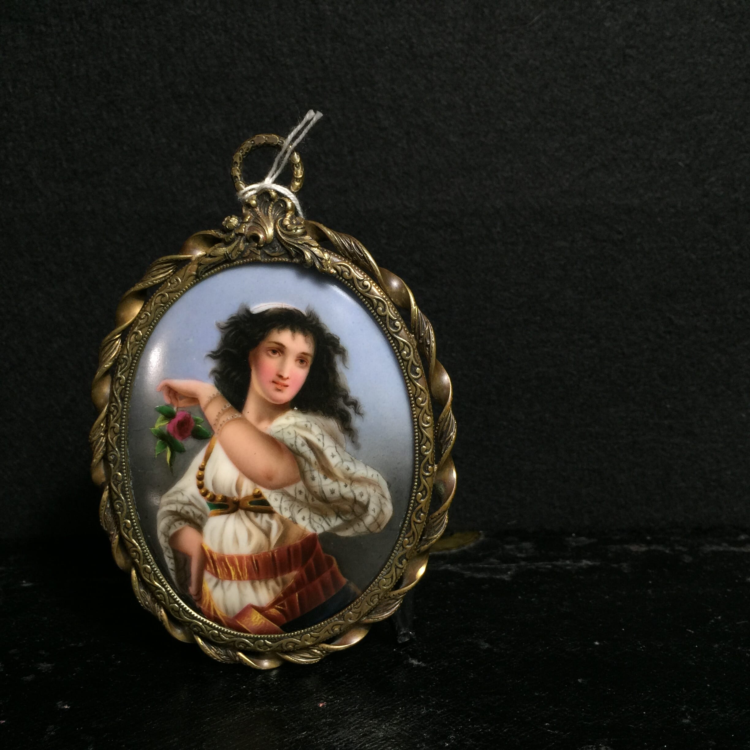 Continental Plaque painted with a Gypsy girl with rose, 19th century.-0