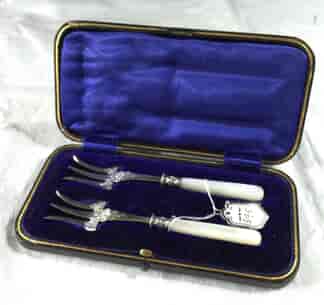 Two pearl handled pickle forks, c. 1890-0