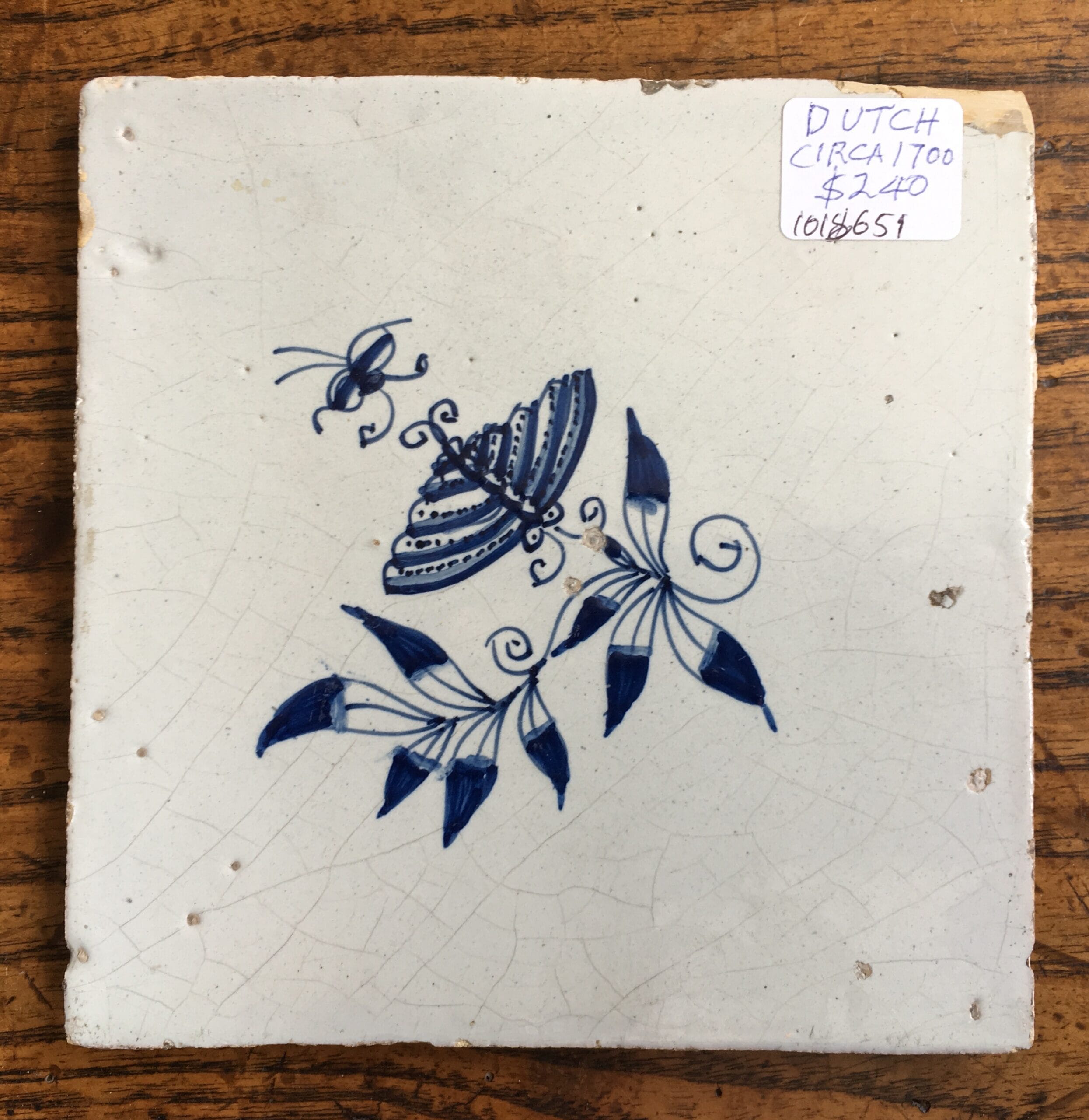 Dutch Delft tile with a butterfly & flower, c.1700-0