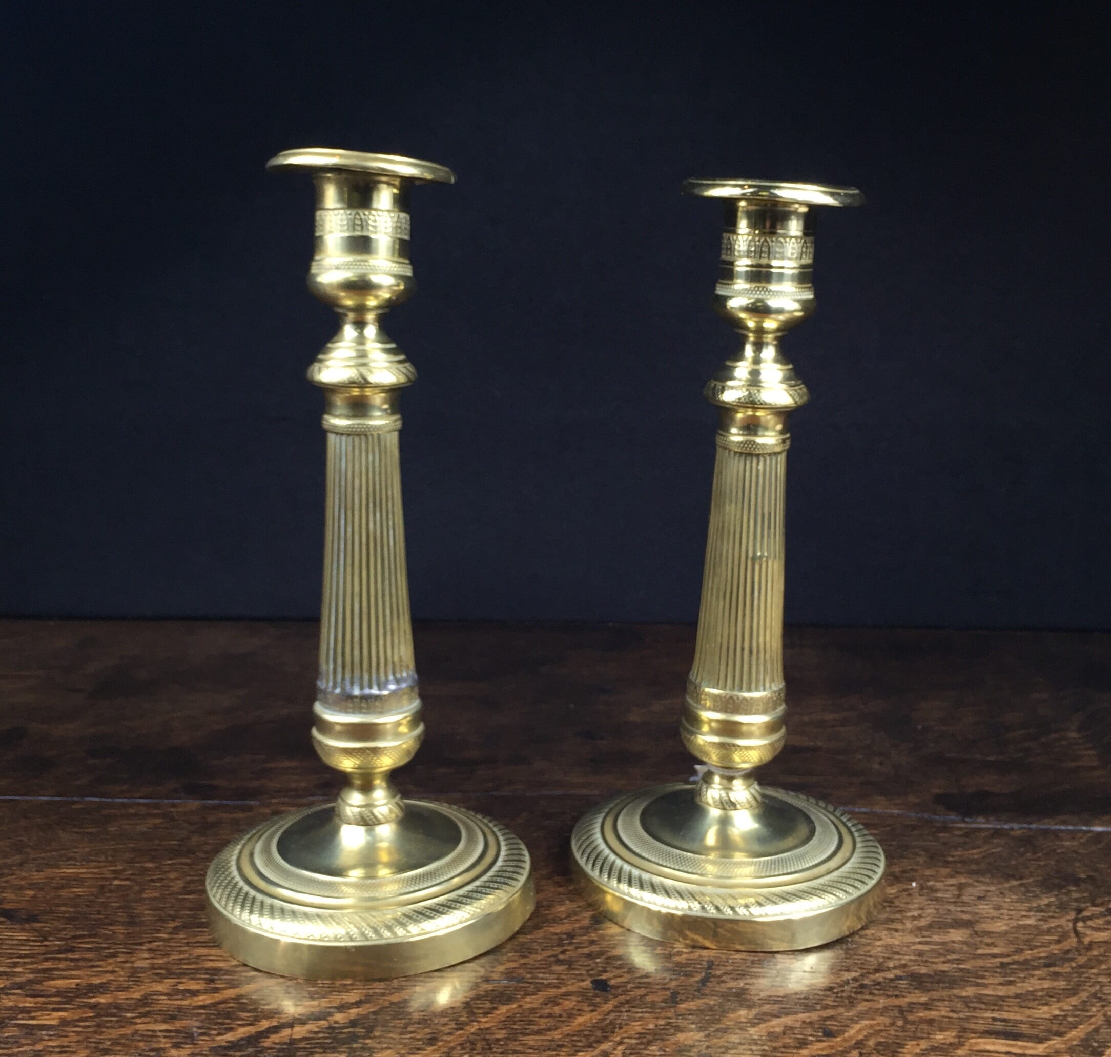 Pair of French brass candlesticks, fluted columns, earlier 19th