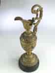Small Victorian ormolu style ewer on wooden base, c. 1890-0