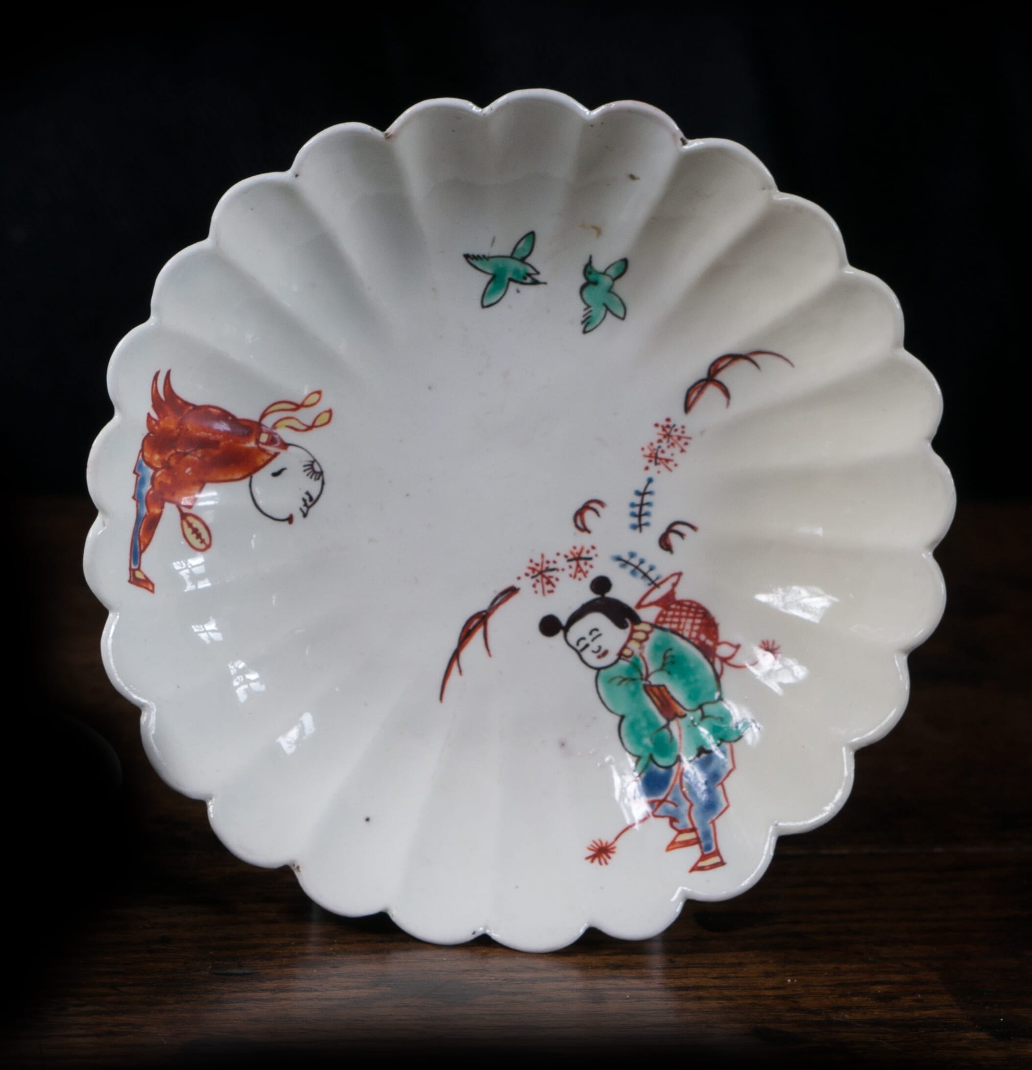 Chantilly lobed saucer, Kakiemon pattern with two Chinese boys, c. 1740-0