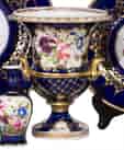 Coalport urn shape vase, lions head handles, flowers on blue ground, c.1820-0