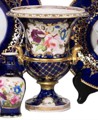 Coalport urn shape vase, lions head handles, flowers on blue ground, c.1820-0
