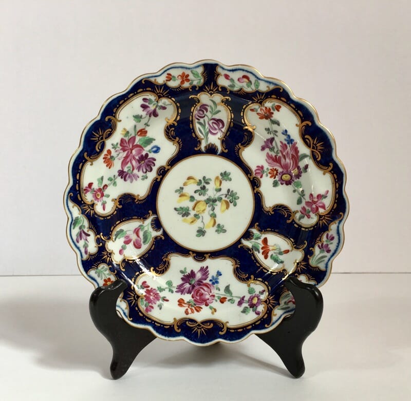 Small Worcester plate, scale blue with James Giles flower panels, c. 1765-0