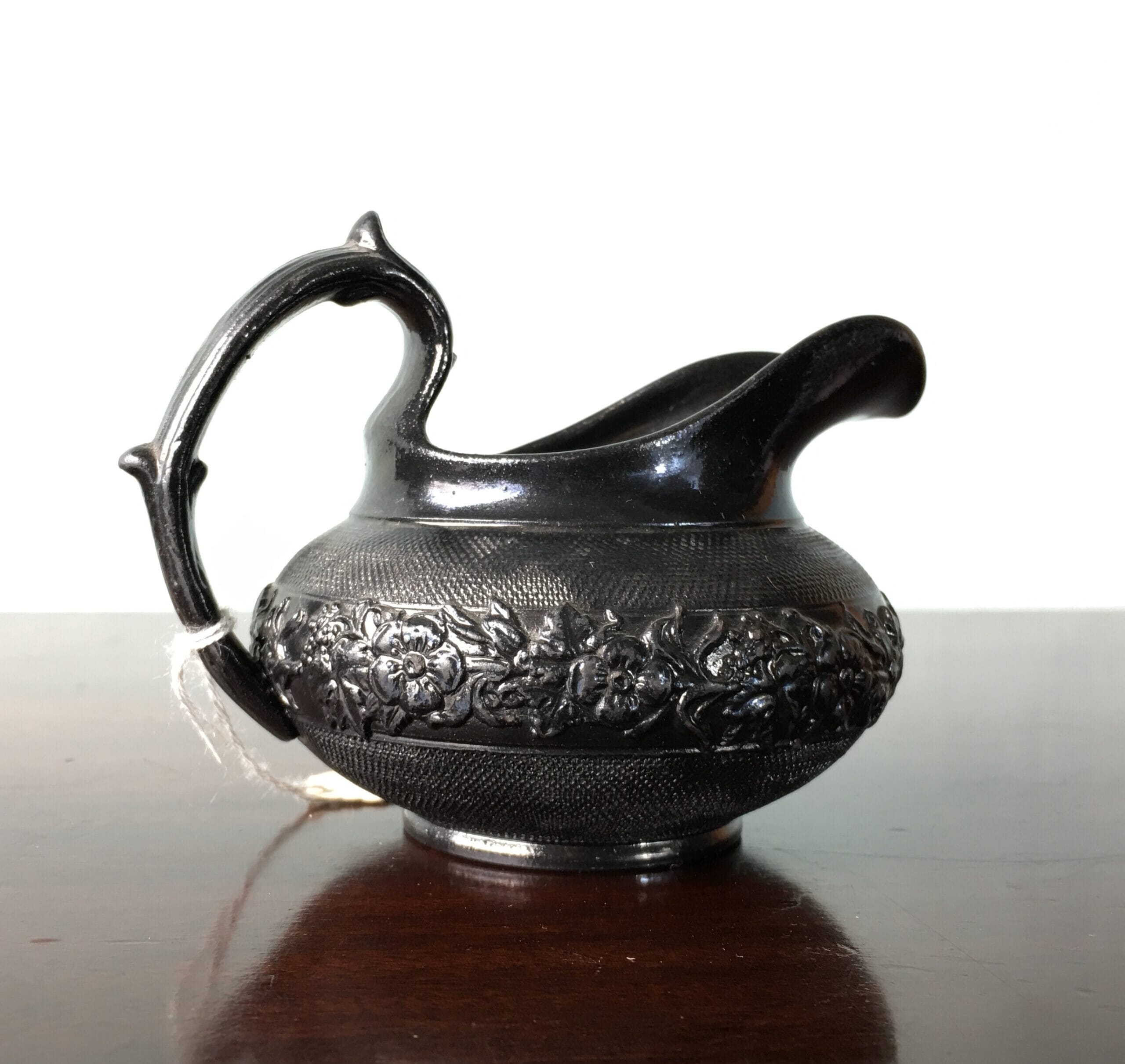 English 'Egyptian Black' pottery milk jug, flower moulded, c.1830 -0