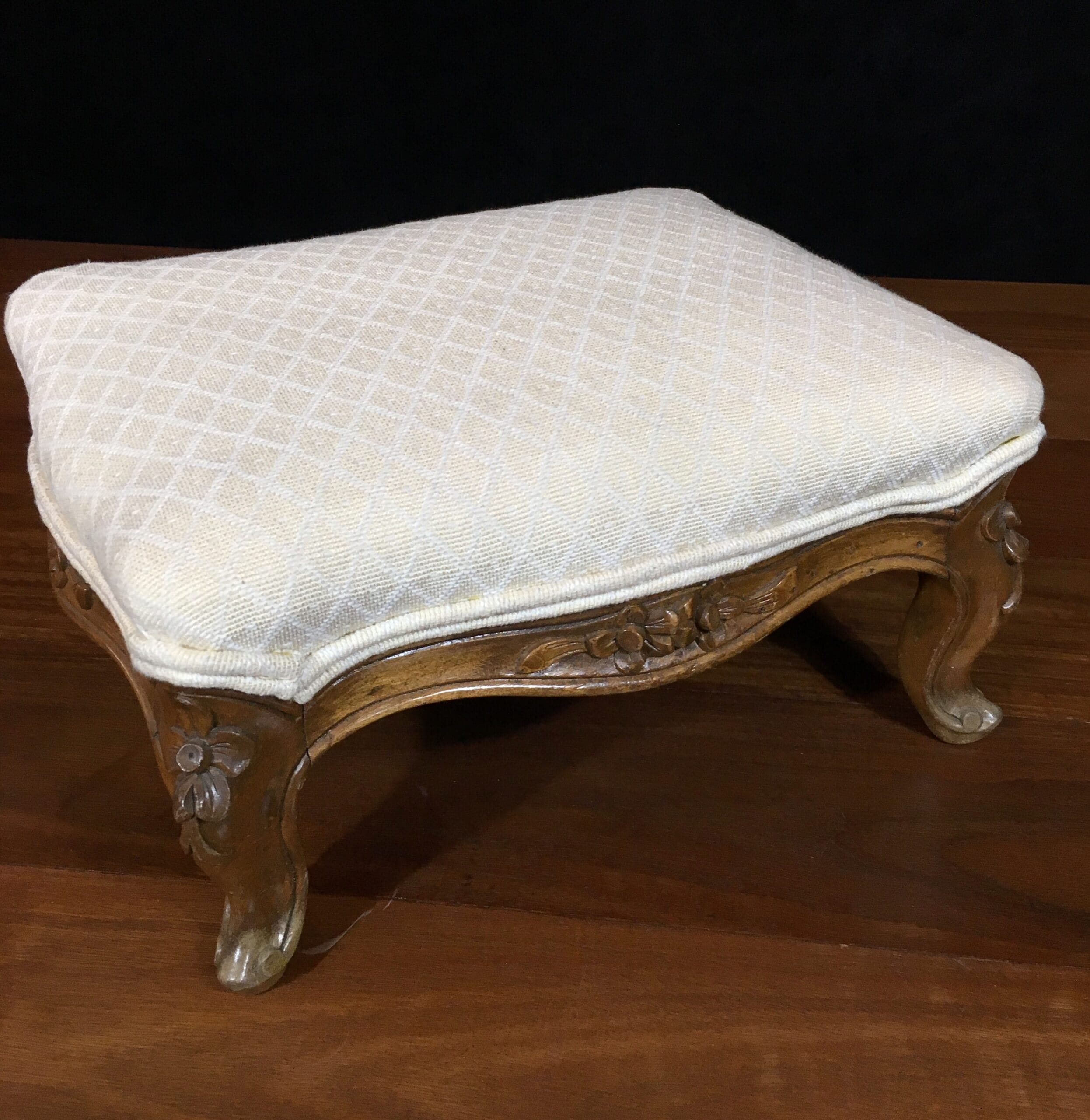 Small French stool with carved legs and cream upholstery. c. 1875 -0
