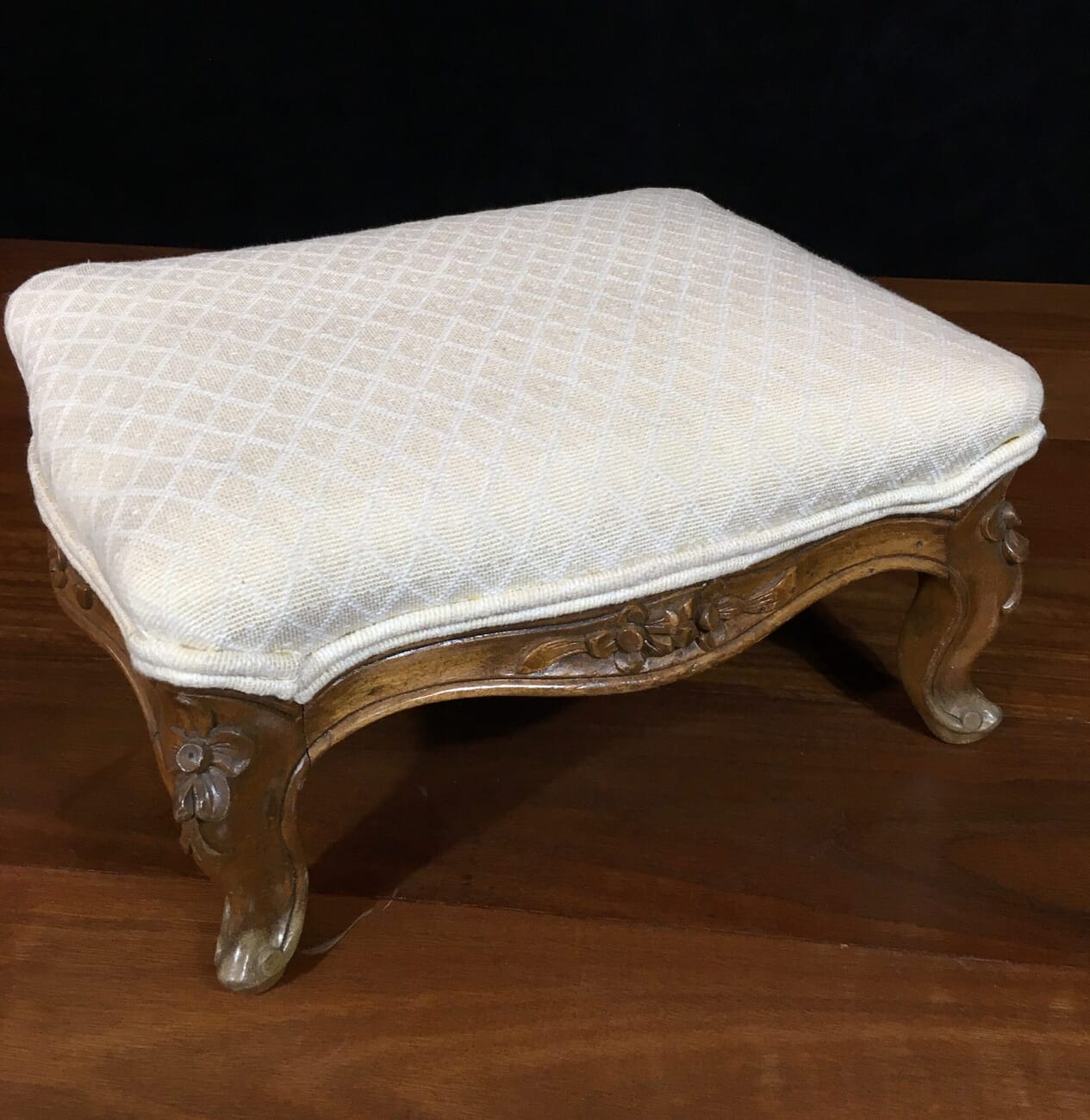 Small French stool with carved legs and cream upholstery. c. 1875 -18888