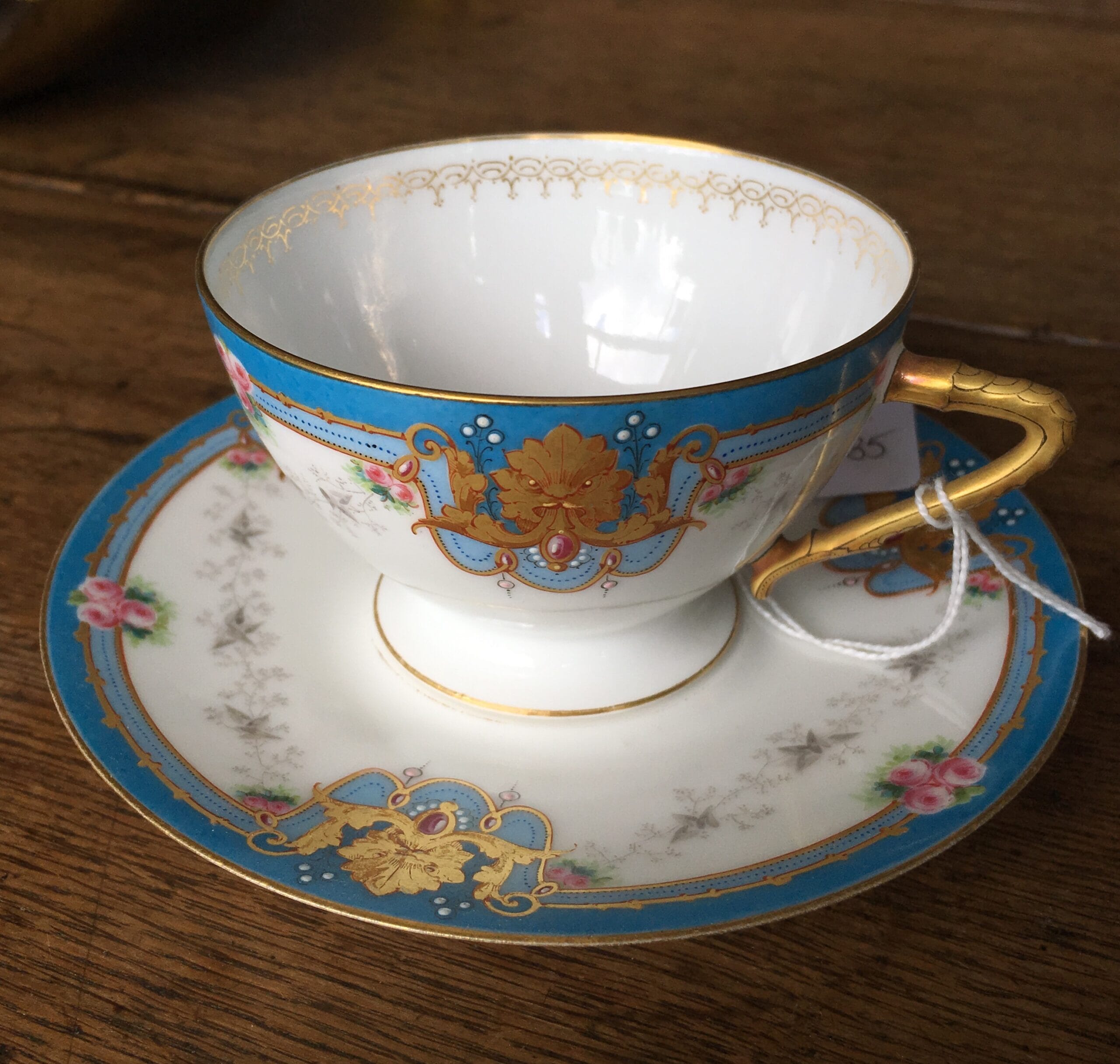 Limoges porcelain cup & saucer, ornate gilt on blue ground, c. 1875-0