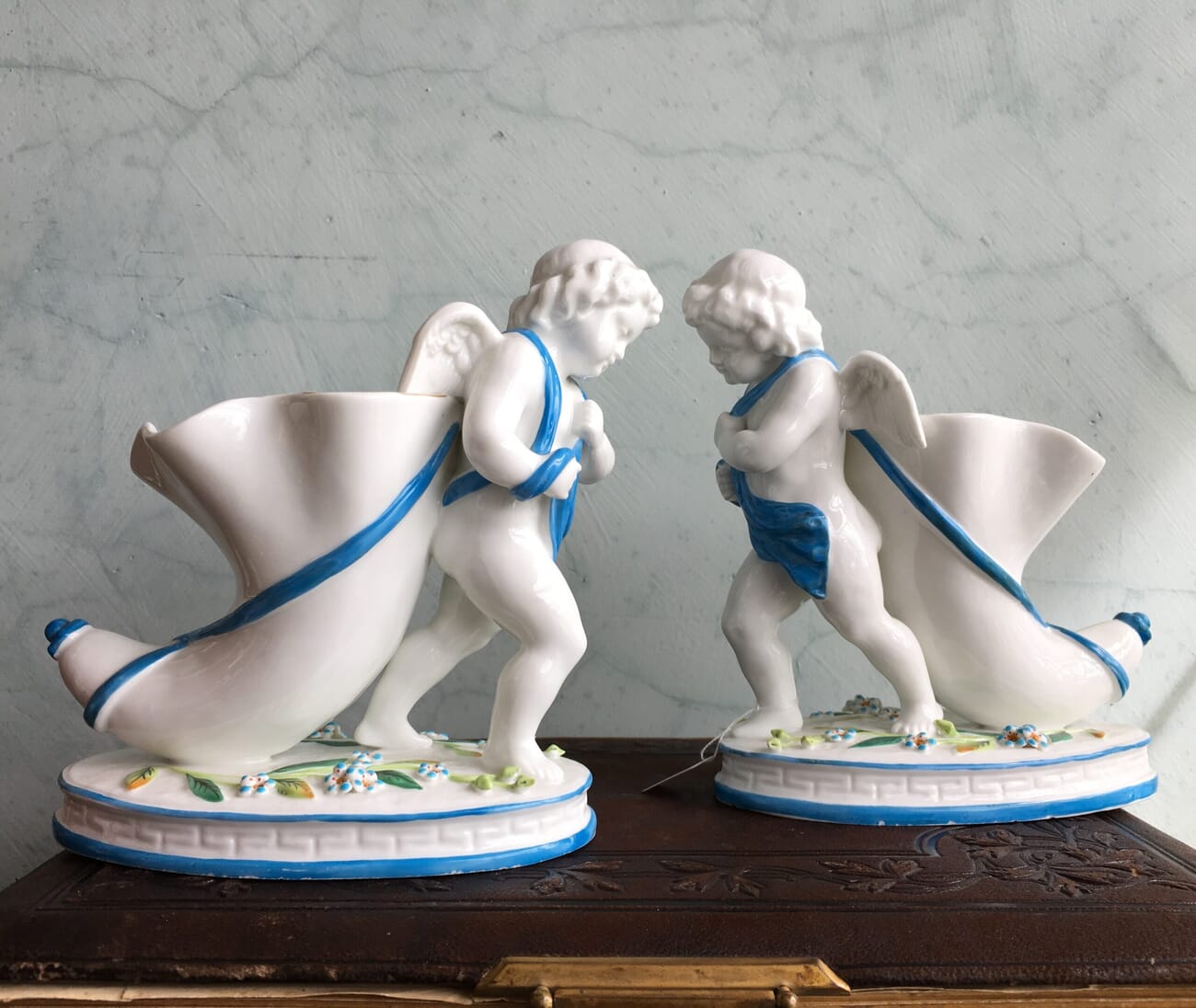 Pair of English porcelain cherub cornucopia vases, c.1875-18654