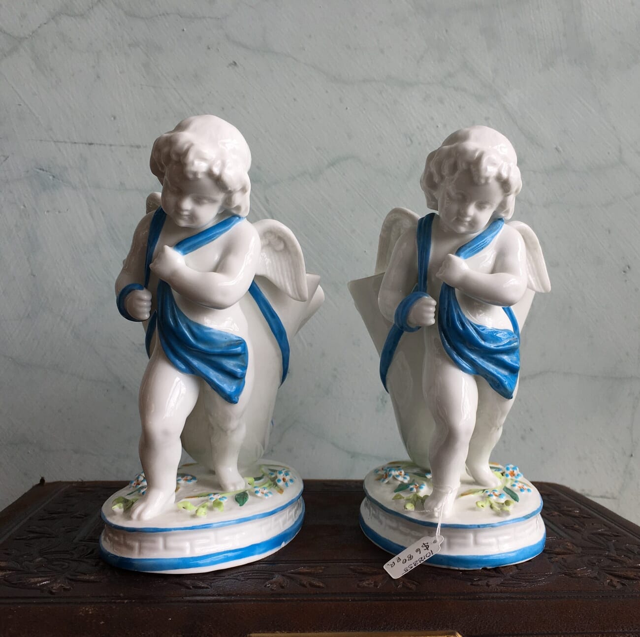 Pair of English porcelain cherub cornucopia vases, c.1875-18651