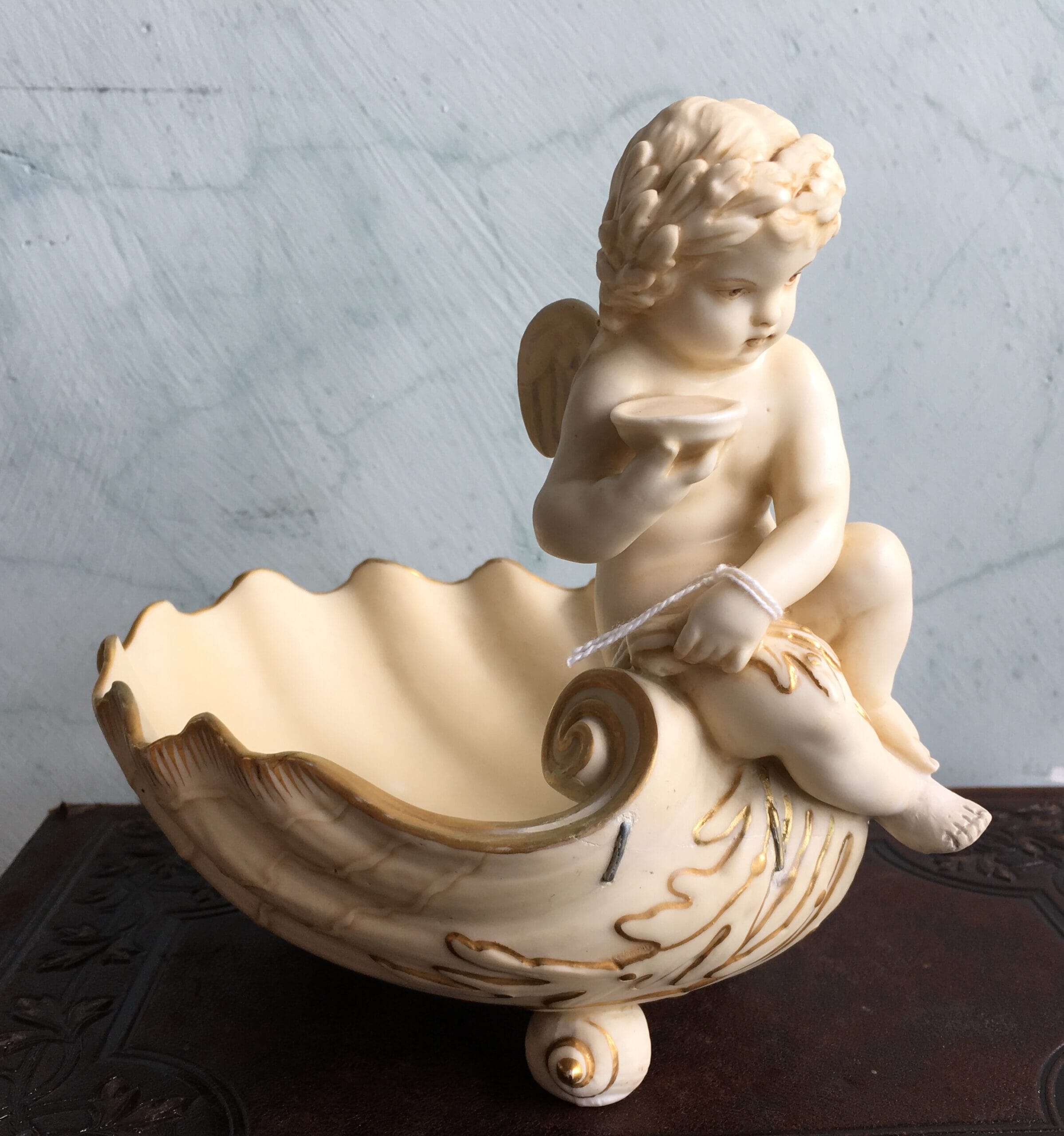 Minton 'Ivory Bisque' shell dish with Cupid, 1892-0