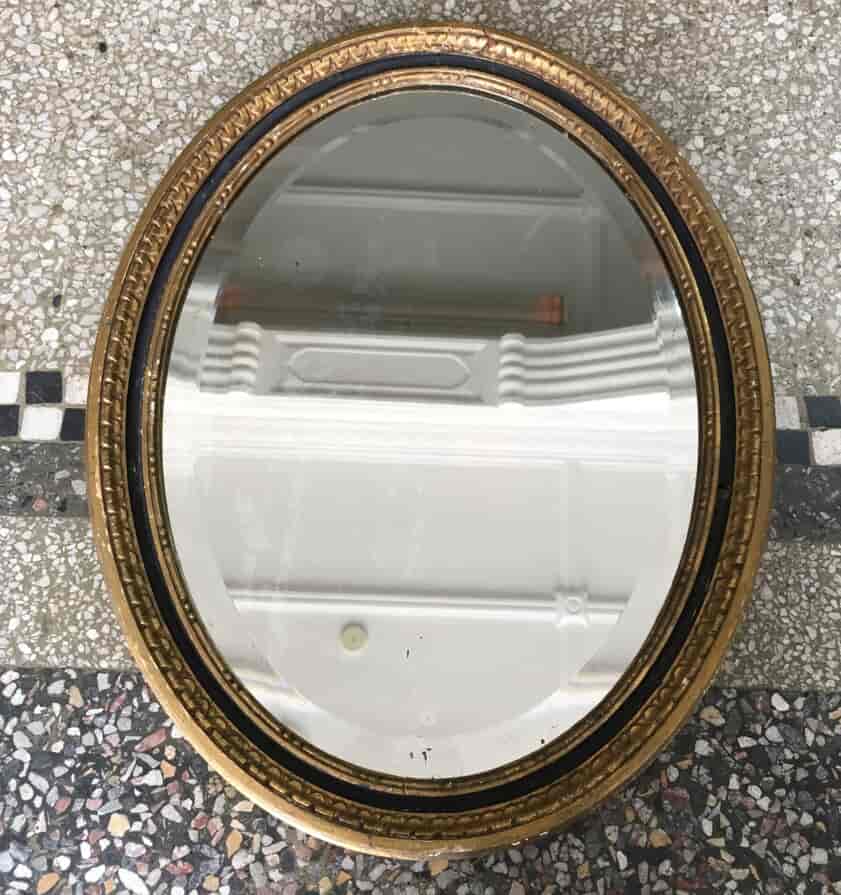 Gilt wood oval bevelled mirror, c. 1800-0