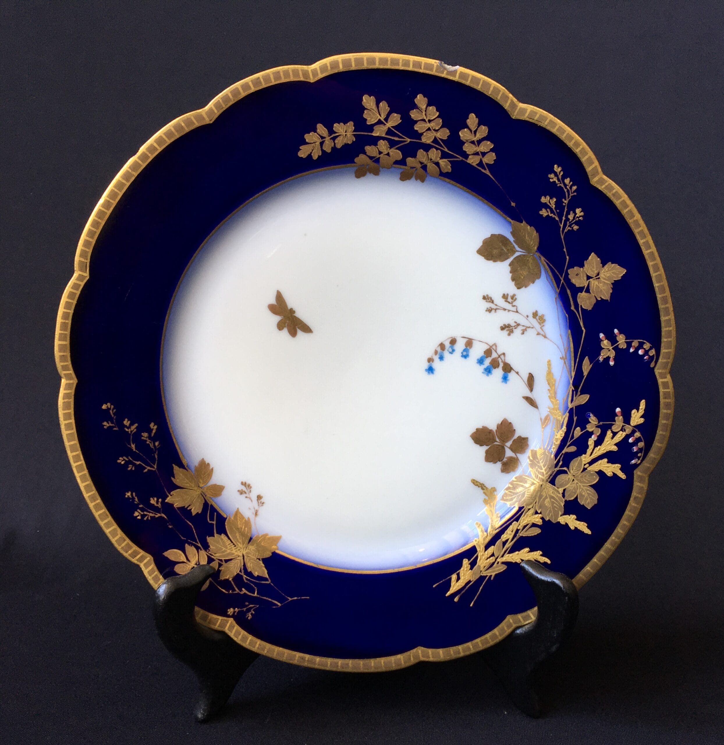 Limoges porcelain plate, mazarine blue with gilt flowers & butterflies, c. 1890-0