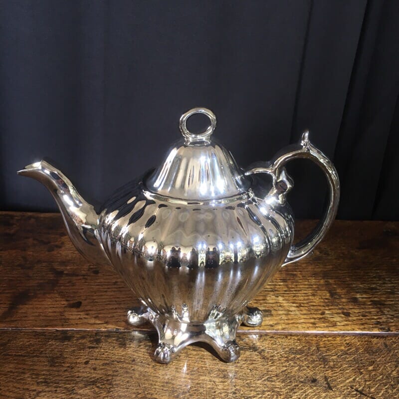 Platinum lustre pottery teapot of silver form, c. 1860-0