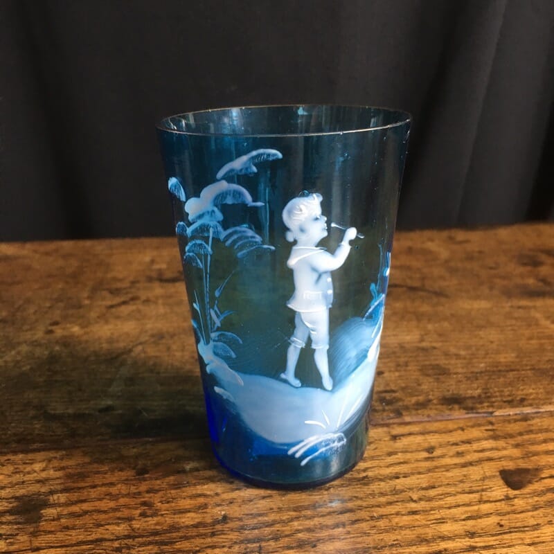 Mary Gregory blue glass beaker, child with flute, c. 1890-0