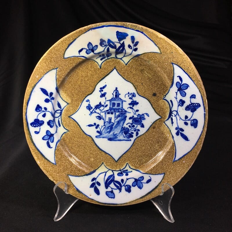 English delft plate, pagoda & flowers on brown ground, c. 1760 -0