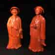 Pair of Chinese figures in coral red glaze, Qing Dynasty 19th century-0