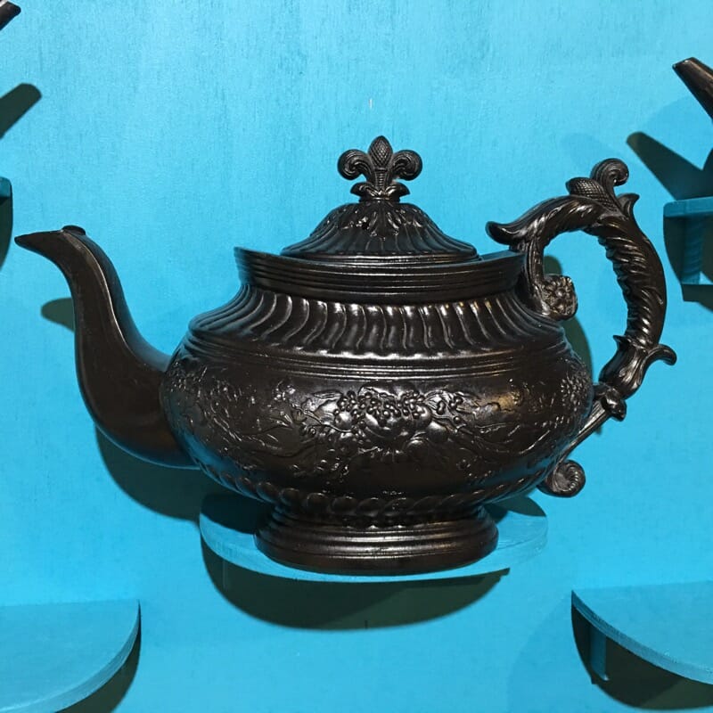 Cyples large black basalt teapot, flower moulding with ornate handle, c. 1825-0
