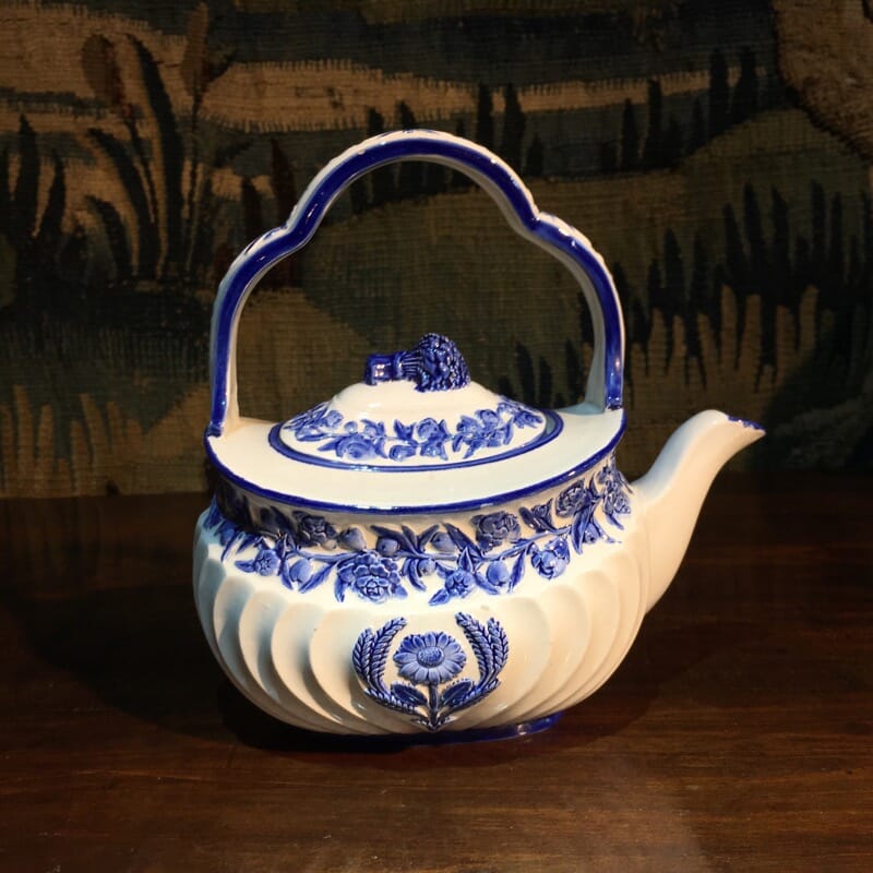 Wedgwood creamware kettle, moulded flowers picked out in blue, dated 1879 -0