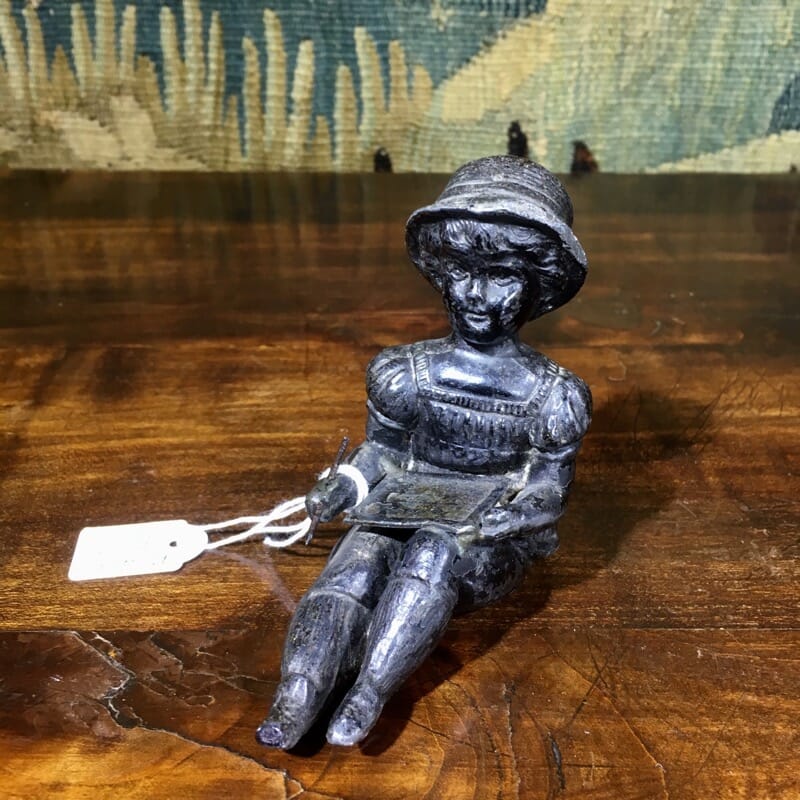 Spelter figure of a young girl writing, c. 1880 -0