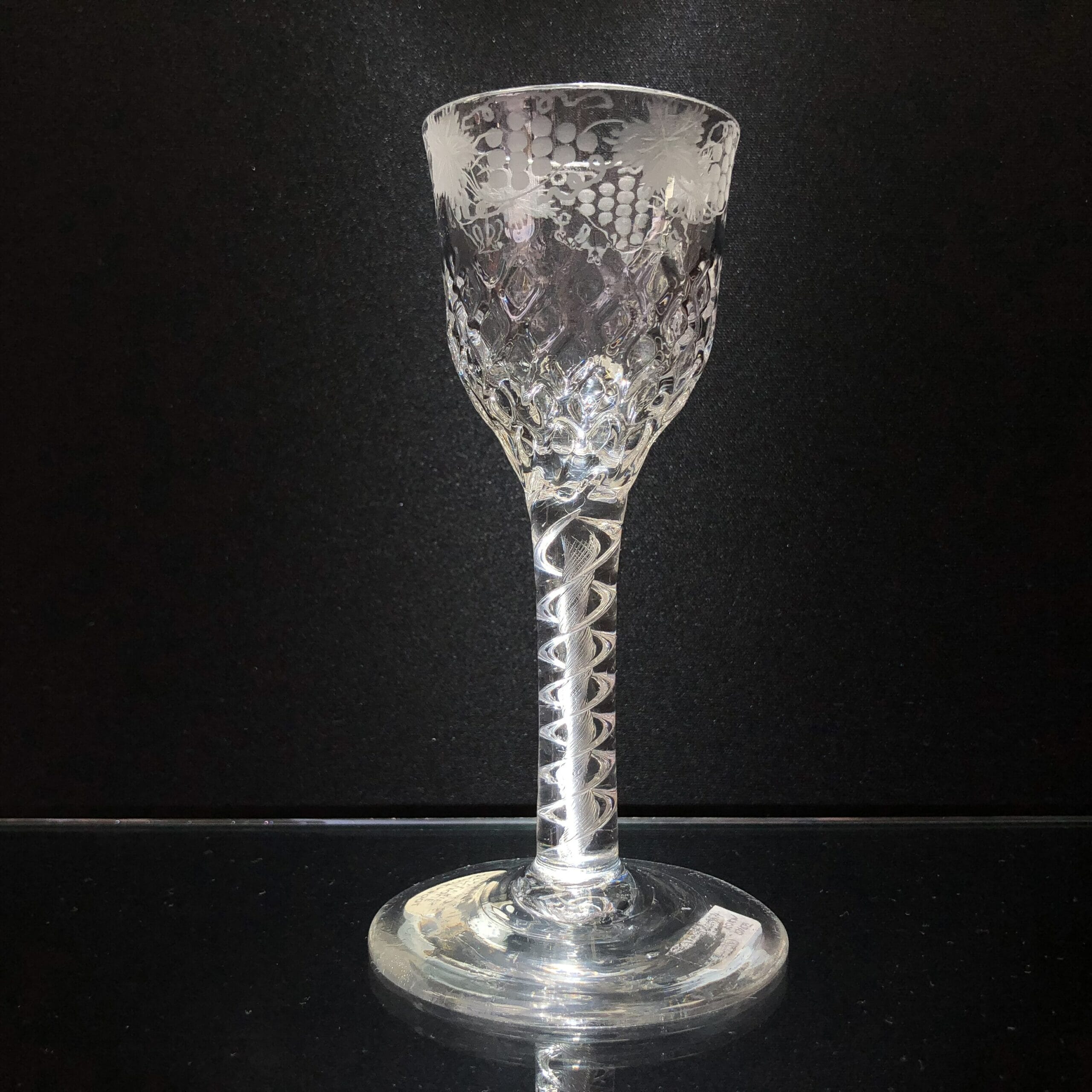 Georgian airtwist wine glass, honeycomb bowl engraved with fruiting vine, c.1790-0