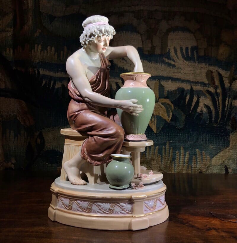 Royal Dux figure of a potter at work, late 19th century.-0