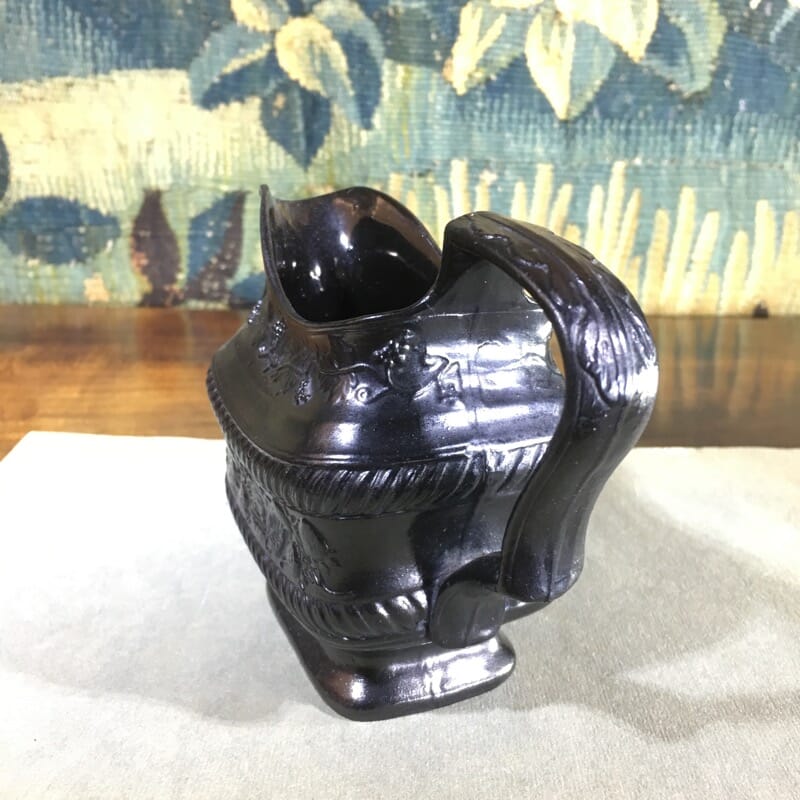 Black Basalt milk jug, strawberry moulded, c. 1820. -31085