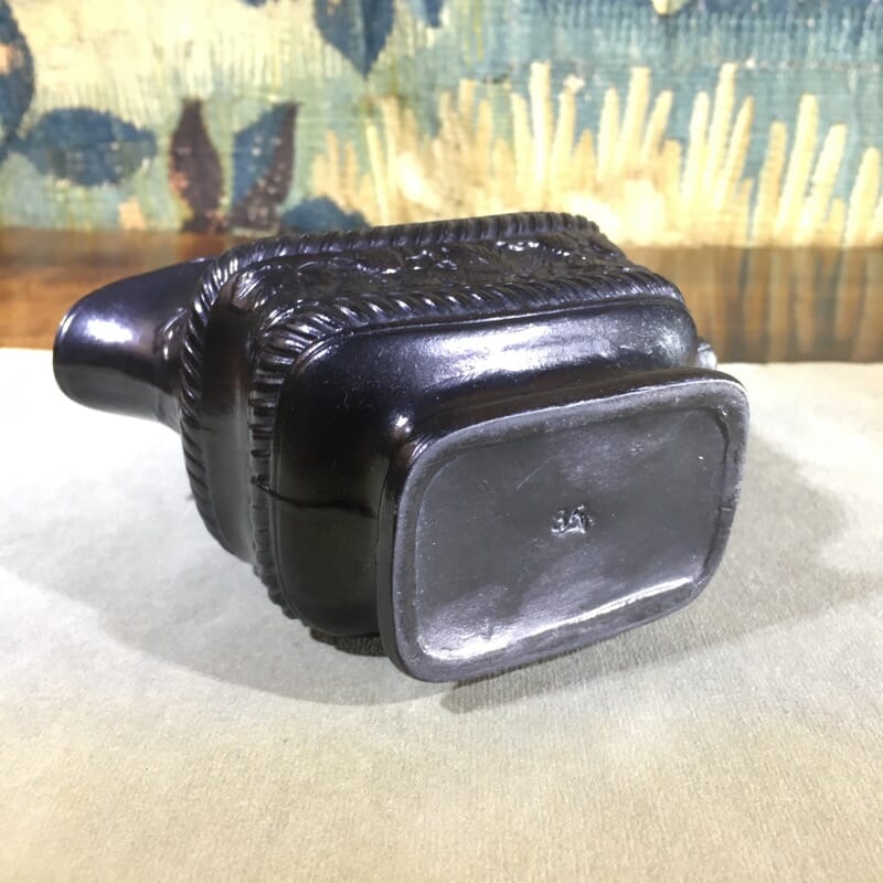 Black Basalt milk jug, strawberry moulded, c. 1820. -31084