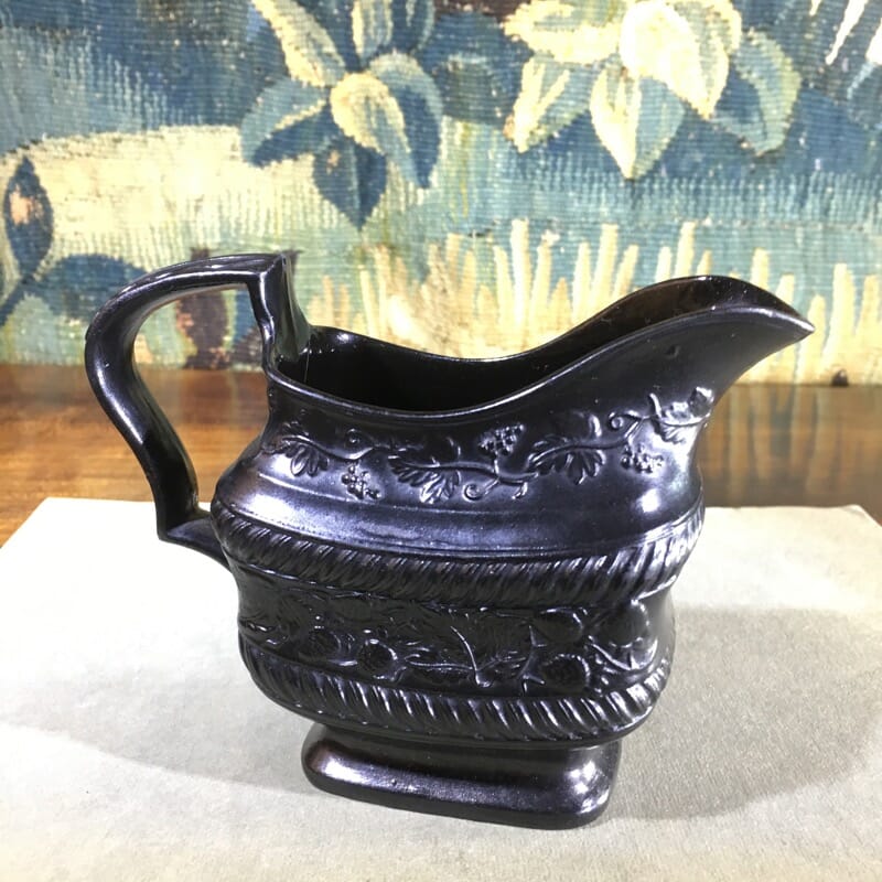 Black Basalt milk jug, strawberry moulded, c. 1820. -0
